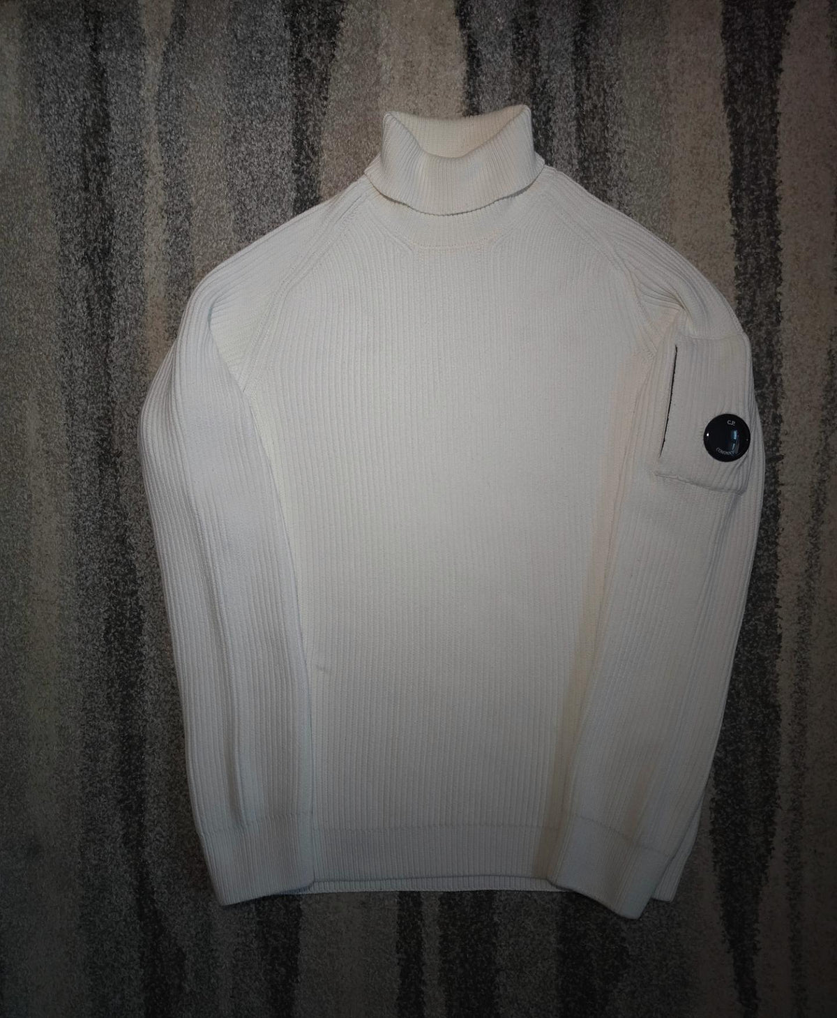 C.P. Company Full Rib Roll Neck Jumper – 15CMKN079A 006608A 103 – Gauze White – 50